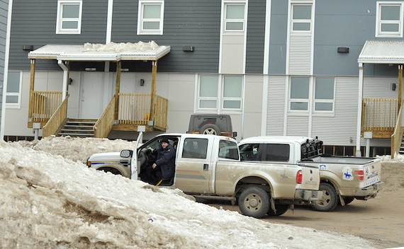 RCMP vehicles are parked beside a unit in Iqaluit's Creekside Village at 8 a.m. May 2. (PHOTO BY THOMAS ROHNER)