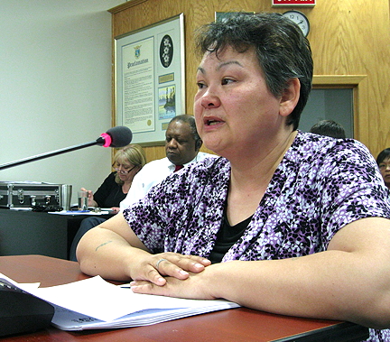 Jeannie Arreak-Kullualik tells councillors May 12 that she opposed a motion to eliminate the opening prayer from council meetings. (PHOTO BY PETER VARGA)