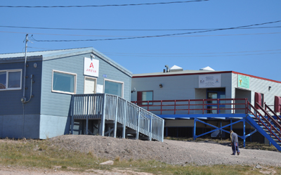 A resident of Bake Lake walks by AREVA Resources Canada's local liaison office in the Kivalliq community. The NIRB said May 8 that it does not recommend that AREVA's uranium project go ahead for the time being. (FILE PHOTO)