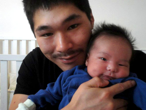 Baby Makibi and his father, Luutaaq Qaumagiaq, pose for a picture, posted to Facebook on Jan. 25, 2012. 