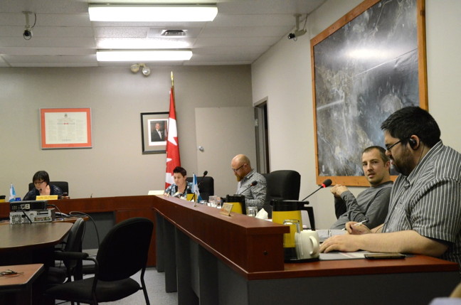 Iqaluit councillors Stephen Mansell, far right, and Kenny Bell, next to him, weren't the only two to get into a war of words June 23 over a new bylaw that would govern councillors' conduct. Mayor Mary Wilman, left, eventually joined the fray. (PHOTO BY DAVID MURPHY)