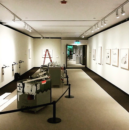 This is how the exhibition looks at the McMichael Canadian Art Collection gallery, with iPads set up for use and Pudlo Pudlat prints on the wall. (PHOTO COURTESY OF PINNGUAQ)