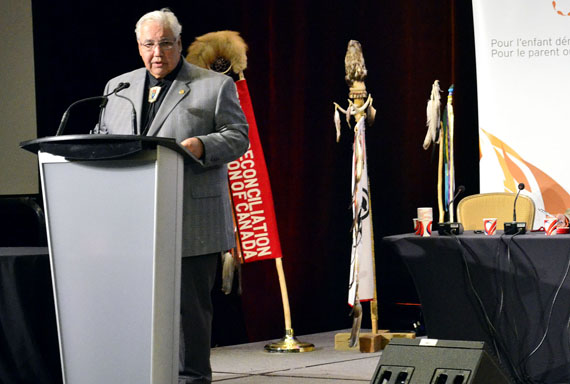 Justice Murray Sinclair introduces the Truth and Reconciliation Commission's summary report, which includes 94 recommendations, a 243-page collection of survivor testimonies and a 194-page collection of the commission's findings. (PHOTO BY JIM BELL)