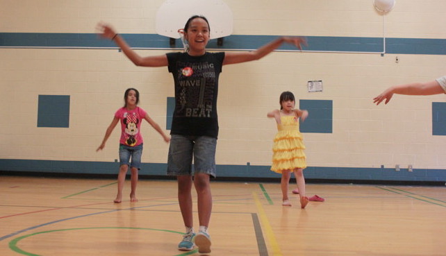 Groove it girls! From left Liitia, Crystal and Cassie bust a few moves July 23 at this week's Ottawa Inuit Children's Centre day camp at Queen Elizabeth Public School in Ottawa. (PHOTOS BY LISA GREGOIRE)