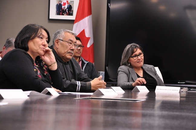 The Canadian government announced a major investment in Iqaluit's marine infrastructure in Iqaluit July 30. In a well-timed pre-election windfall, Nunavut's MP, Leona Aglukkaq, said at a news conference in Iqaluit's Qamutik Building that Ottawa would commit $63.7-million in funding for a deep sea port, sealift facility and small craft harbour in Iqaluit. The Government of Nunavut would be on the hook for the remaining $21.2-million of a project estimated to cost about $85 million. The GN's economic development and transportation minister, Monica Ell, said at the same conference that she will table the proposed project and budget during the fall's sitting of the legislature. Above, Aglukkaq, right, along with Simon Nattaq and Cathy Towtongie, president of Nunavut Tunngavik Inc., listen to Ell during the July 30 announcement. (PHOTO BY THOMAS ROHNER)