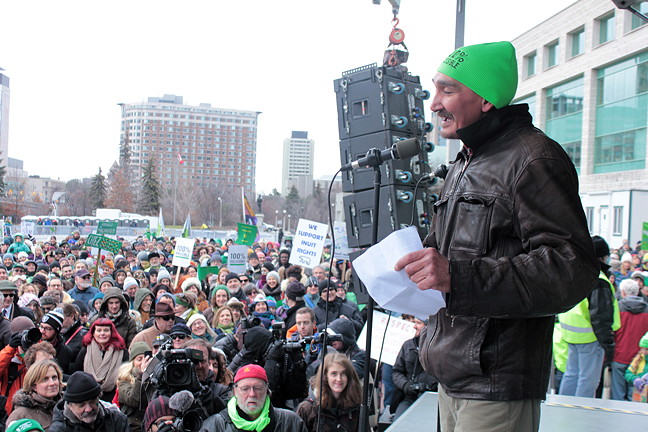 Jerry Natanine, mayor of Clyde River, speaks to thousands in front of Ottawa city hall Nov. 29, prior to a march on Parliament Hill in support of renewable energy. The event, called 100% Possible and organized by Ecology Ottawa, was timed to coincide with the start-up of the United Nations COP 21 climate change talks, which get underway Nov. 30 in Paris. It was described by some media as Ottawa's largest ever public rally. Natanine, who was invited to speak thanks to the public profile he's earned fighting oil and gas seismic testing off Baffin Island, admitted he was nervous before taking the stage but the audience cheered several times during his speech and some even waved signs which read 