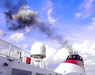 Soot particles from ship engine exhaust systems, such as this one, fall to the ground in the Arctic where they magnify heat. COP21 will produce a non-binding agreement aimed to reducing soot, also called black carbon. (FILE PHOTO)