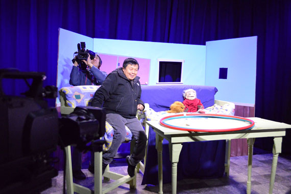 Johnny the Travelling Lemming, whose head is just poking above the table, talks to reporters Dec. 4 at the opening of IBC's media arts centre in Iqaluit. (PHOTO BY STEVE DUCHARME)