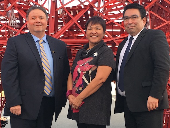 At COP21 Nunavut Premier Peter Taptuna, Inuit Circumpolar Council President Okalik Eegeesiak and Greenland's Finance, Mineral Resources and Foreign Affairs Minister Vittus Qujaukitsoq pose in front of a rendering of the iconic Eiffel Tower — made from old chairs. (HANDOUT PHOTO)