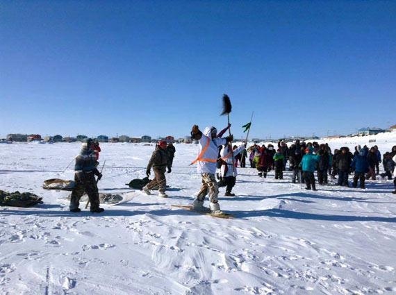 John Clarence Kawapit, the Cree man who is walking Nunavik’s coast to overcome his long-time alcohol dependency, arrives at his second destination, Inukjuak, Feb. 25, to a crowd of supporters and local residents. Kawapit did the first leg of the walk solo, leaving his hometown of Whapmagoostui Jan. 30 and arriving in Umiujaq Feb. 11. From there, four Nunavimmiut walkers joined Kawapit on the two-week journey to Inukjuak: Alaku Calvin, Jimmy Tooalook, Jimmy Tooktoo and David Qaqatuk. Kawapit plans to walk the entire coast of Nunavik. (PHOTO COURTESY OF LUCY NOWRA) 
