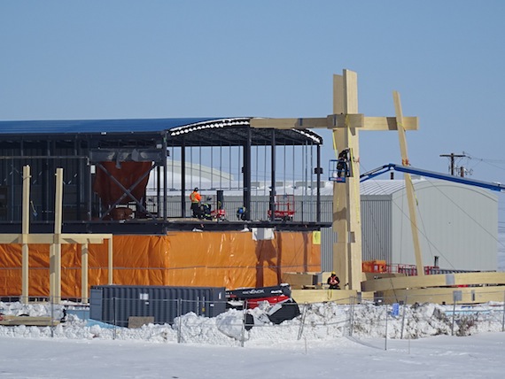 Workers continue the construction of the Canadian High Arctic Research Station April 22 in Cambridge Bay — even before the building is closed in, architects have plans for how to integrate art 