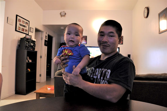 Luutaaq Qaumagiaq with his eight-month-old child, Lucas. He said he and his partner Neevee Akesuk still don't trust the GN health department. (PHOTO BY THOMAS ROHNER)