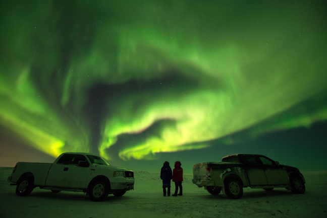 A little dose of awesome aurora to brighten your Arctic January. Marg Epp, left, and Athlyne Etienne enjoy a spectacular display of northern lights near Cambridge Bay around 9:30 p.m. Dec. 22. It was around -30 C, clear and crisp, with no wind so perfect aurora viewing weather. The sun is expected to make its first 2017 appearance in Cambridge Bay on Jan. 11 but only for about 28 minutes. From then on, daylight hours in that western hub town will continue to grow until it shines for 24 hours, starting May 21. (PHOTO BY DENISE LEBLEU IMAGES) 