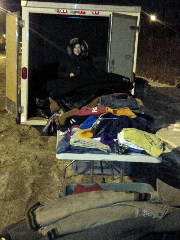 A member of Helping Our Northern Neighbours-Winnipeg and Eastern Manitoba sets up outside of the Kivalliq Inuit Centre in Winnipeg with clothing donations for patients staying at the boarding home. The group will be back at the centre this week with winter clothing and goodie bags for patients away from home for the holidays. (PHOTO COURTESY OF T. NEUBAUER)