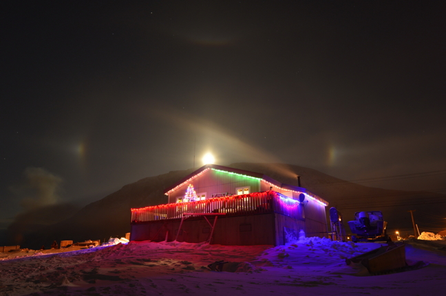 December in the Arctic is a time of darkness but Charlie and Naomi Komoartok of Pangnirtung are doing their part to bring colour and holiday magic to their community. With a moondog hanging overhead, the heavens seem to approve. Nunatsiaq News would like to thank all our letter writers, commenters and those who have contributed stories and photos during 2016. You made us better. Those contributors include: Clare Kines, Sarah Meeko, David Kilabuk, Isabelle Dubois, Frank Reardon, Darren Brooks, Maggie Putulik, Denise Lebleu, Eric Anoee, Noel Kaludjak, Gordy Kidlapik, Ron Wassink, Mark Aspland and Nunavut Images, Niore Iqalukjuak, Aimo Paniloo, Doug McLarty, Red Sun Productions, Brian Tattuinee, Bernard Ungalaaq Maktar, Lars Qaqqaq, Allen Gordon, Kelly Buell, Courtney Edgar, David Murphy, James Morton, Tristan Brand and Claude Constantineau. Apologies to anyone we might have forgotten. Barring emergencies and breaking news, Nunatsiaqonline.ca will not be updated until Jan. 3. We wish all our readers, followers and advertisers a peaceful and joyous holiday season. (PHOTO BY DAVID KILABUK)
