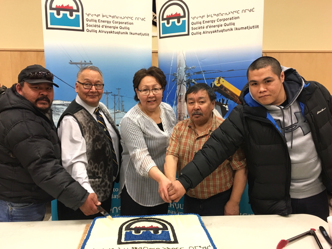 Qulliq Energy Corp. officially opened a new power plant in Qikiqtarjuaq March 30 with a community gathering and feast. A few territorial leaders joined in to help celebrate and cut the cake at the hamlet's community hall. From left: plant superintendent Gary Metuq, Johnny Mike, minister responsible of QEC, Qikiqtarjuaq Mayor Mary Killiktee, Pauloosie Keyootak, MLA for Uqqummiut, and assistant plant operator, Glen Sanguya. (PHOTO COURTESY QEC)