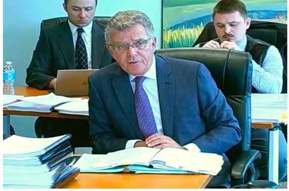 Terrence O'Sullivan, one of the two lawyers representing the Qikiqtani Inuit Association at last week's arbitration hearing in Vancouver. Behind him sits QIA President PJ Akeeagok and Stephen Williamson Bathory, QIA's director of special projects. (WEBSTREAM VIDEO GRAB)