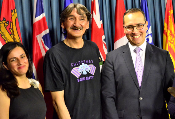 Jerry Natanine, the former mayor of Clyde River, with Farrah Khan of Greenpeace Canada (left) and Clyde River's lawyer, Nader Hasan, at a press conference held July 26 in Ottawa. (PHOTO BY JIM BELL)
