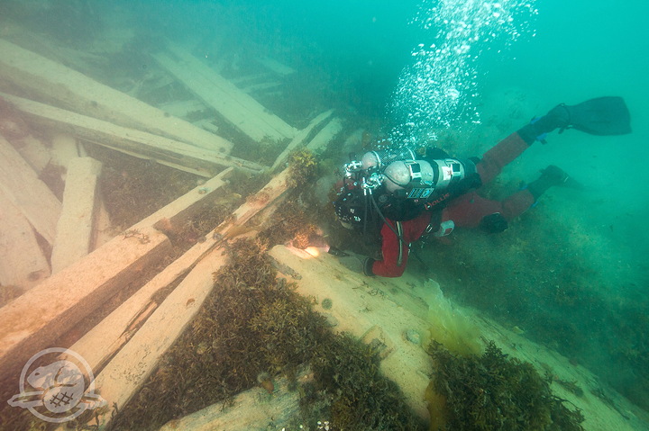 A Parks Canada underwater archaeologist examines the site of the HMS Erebus in August 2017.