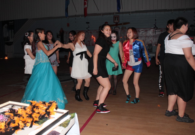 Who cares if it's the day after Halloween? Teen Iqalungmiut dance to their favourite pop tunes at the City of Iqaluit's annual Spook-A-Rama dance. Conor Goddard, the city's youth co-ordinator, said the drug- and alcohol-free dance for 13- to 18-year-olds is in its 28th year and is always popular among youth, as well as the city's generous sponsors, who donate prizes and services. About 100 $5 tickets were sold and, as usual, the location—at the Cadet Hall this year—was kept secret. Grade 11 student Peter Nookiguaq helped decorate the hall earlier in the day, something he's done in the past, he says, because he enjoys getting involved and helping out. (PHOTO BY LISA GREGOIRE)