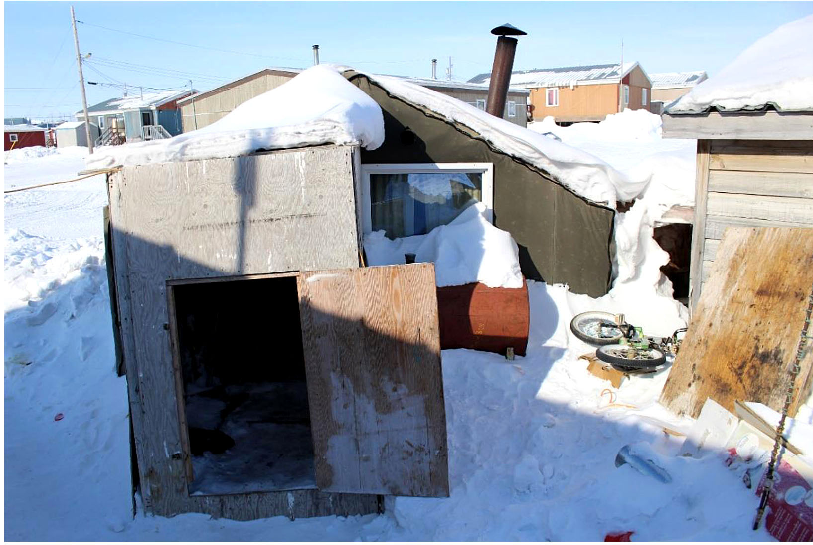 This badly constructed wooden shed in Igloolik housed a young family at the time the photo was taken. (IMAGE FROM SENATE COMMITTEE REPORT)