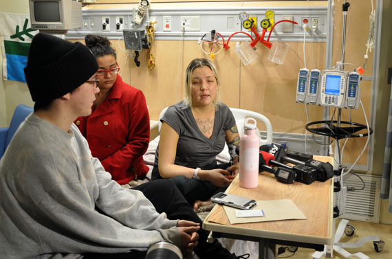 Delilah Saunders speaks to media Dec. 19 for the first time since she was diagnosed with acute liver failure last week. She's seen here in her hospital room with her lawyer, Caryma Sa'd, and younger brother Garrett. (PHOTO BY SARAH ROGERS)