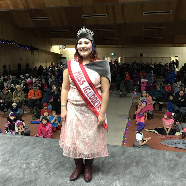 Angela Amarualik is crowned Miss Igloolik during the Christmas games. In the first round of competition, contestants answered questions such as “How would you improve our school system?” and “What is your long-term goal in life?” The second and last round was the talent round, in which Amarualik performed a song she had written for the Qilaut Inuktut songwriting contest. The Miss and Mrs. Igloolik competition was developed to give a voice to women in their community. Miss Igloolik will make public appearances throughout the year. She has already been invited to appear during the Return of the Sun celebrations and will be promoting healthy teeth, by giving out toothbrushes and toothpaste provided by the government's Health Department for the upcoming Health Expo in Igloolik.
(PHOTO BY JOSE QUEZADA)
