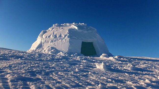 The Sanikiluaq Christmas games featured an igloo-building contest that was open to everyone. This igloo was built by one man and two helpers in fewer than 20 minutes. Sanikiluaq resident Robert McLean said, “If they had been building one for use when out on the land, I think they would have taken their time, but they’d still be finished in less than an hour. Pretty fantastic when you stop to think about it.” (PHOTO BY SARAH MEEKO)

