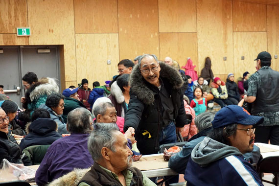 Premier Paul Quassa greets community members in Igloolik earlier this month at a feast following a cabinet retreat in his hometown. (PHOTO COURTESY OF GN)