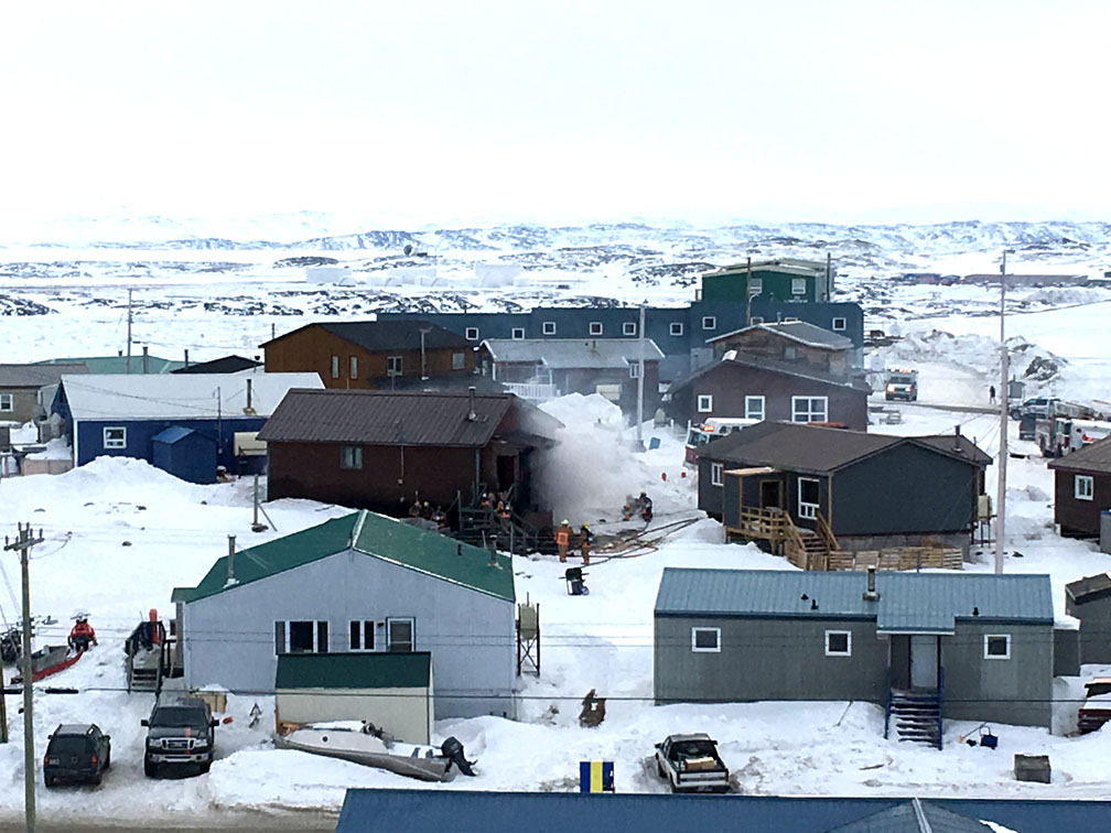 Smoke billows from a fire that struck a house in the Happy Valley neighbourhood of Iqaluit early yesterday evening, when Iqaluit firefighters turned out to contain the blaze. Read more about the fire later on nunatsiaq.com. (SUBMITTED PHOTO)