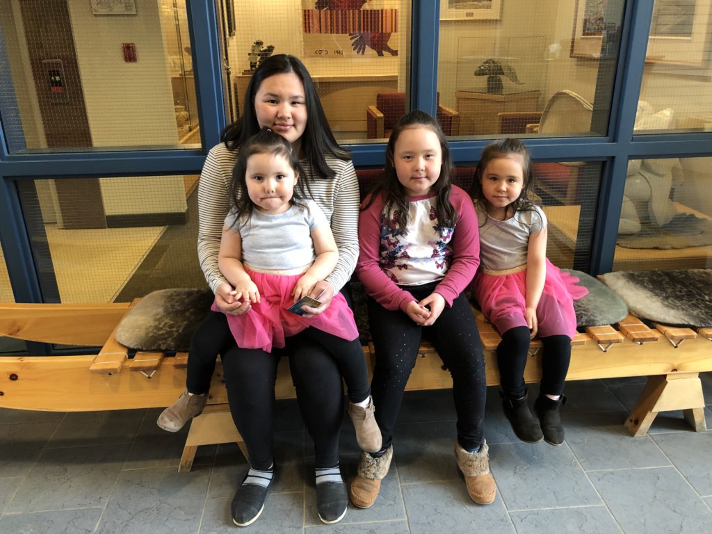 The daughters of Kugluktuk MLA Mila Kamingoak visit their mom at work in the legislative assembly June 13. The assembly has created a commission to look at how to make MLAs' pay packages more family-friendly. (PHOTO BY JANE GEORGE) 