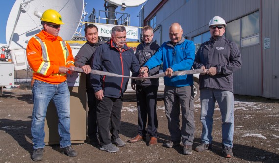 Officials attend a seal-skin ribbon-cutting ceremony on Monday, Sept. 17 to celebrate a new, faster internet service that Northwestel plans to roll out across Nunavut’s communities by the end of 2019. From left, between the Northwestel workers holding the ribbon: Education Minister David Joanasie, Community Services Minister Lorne Kusugak, Northwestel President Curtis Shaw and Premier Joe Savikataaaq. (PHOTO COURTESY OF NORTHWESTEL)