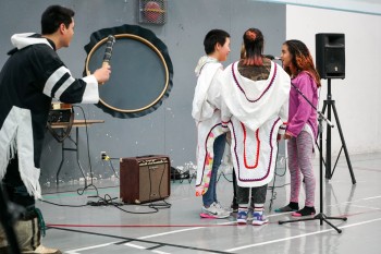 A student group, Atiqtaliit, provides the opening act along with drum dancer Devon Manik for an Alianait concert in Resolute Bay, on Oct. 4. (PHOTO COURTESY OF PARKS CANADA)