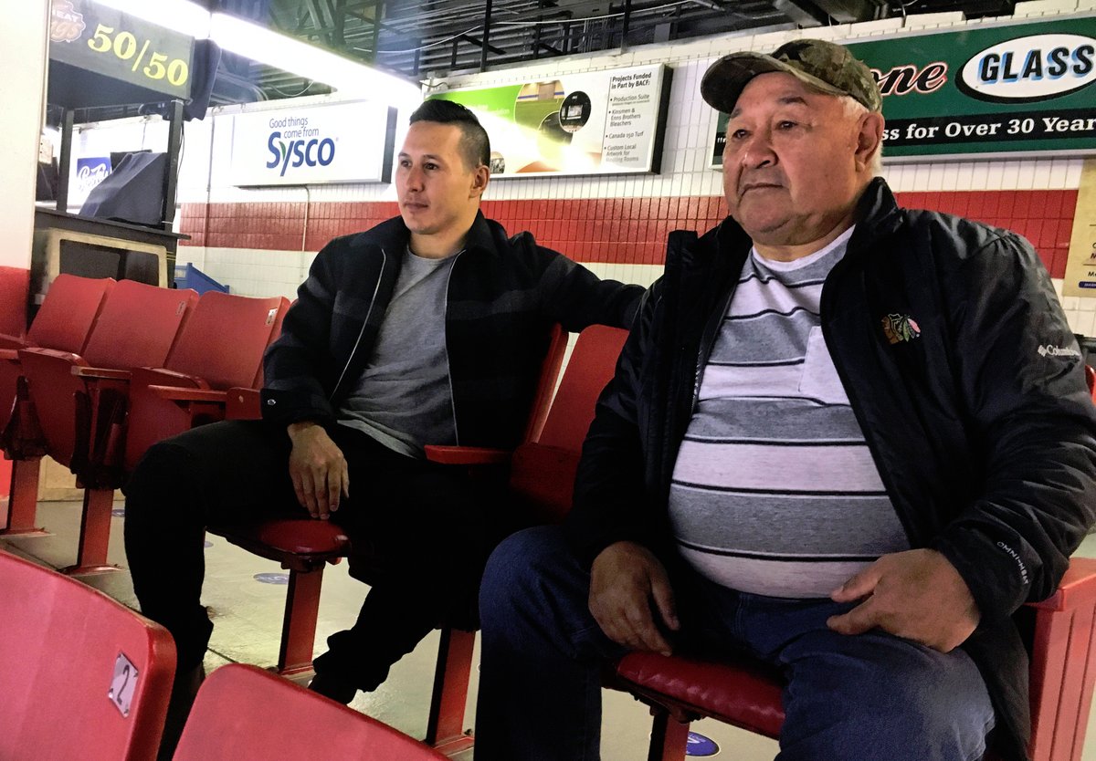 Jordin Tootoo sits with his father Barney Tootoo on Oct. 19 in the Wheat Kings' arena in Brandon, Man., where Jordin later announced his retirement from the NHL. (PHOTO COURTESY OF THE BRANDON WHEAT KINGS)