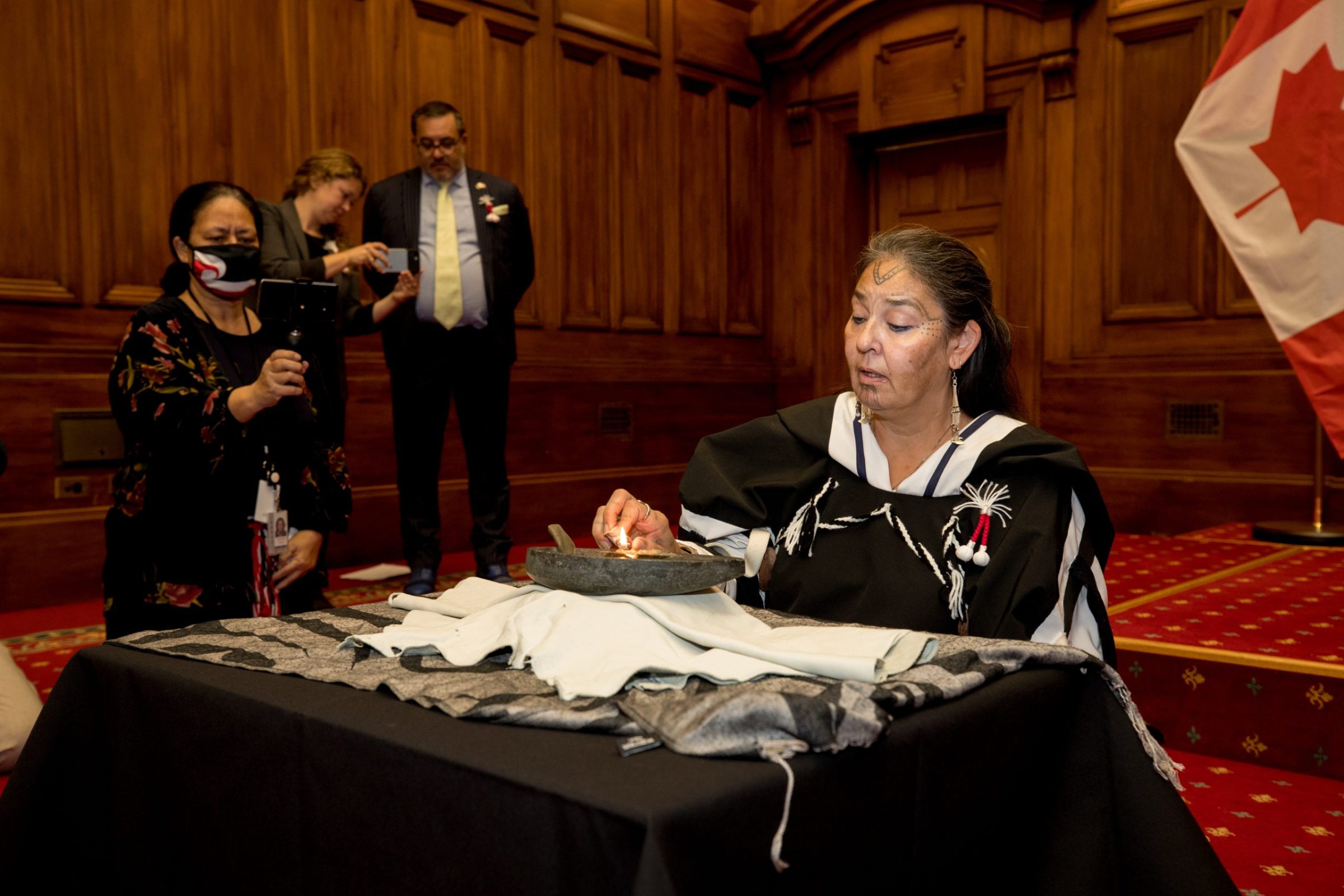 Gerri Sharpe, president of Pauktuutit Inuit Women of Canada, is seen here lighting a qulliq at New Zealand’s parliament in Wellington, the nation’s capital. Sharpe, along with federal Indigenous Services Minister Patty Hajdu, is part of a delegation of Canadian Indigenous leaders to the southern Pacific island nation to build relationships with Māori and government leaders. Both countries are working on an arrangement to promote socioeconomic development of Indigenous Peoples and communities, an emailed statement from Pauktuutit said. (Photo courtesy of Adrian Heke/Pauktuutit)